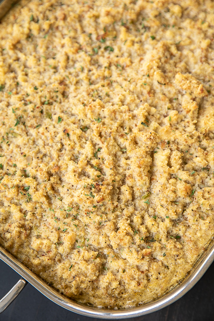 Cornbread Dressing - delicious southern holiday staple. Can make ahead and refrigerate or freezer for later. Makes enough to feed a crowd! Perfect for the holiday meal and leftovers. Homemade buttermilk cornbread, butter, onion, celery, sage, parsley, seasoned pepper, eggs, and chicken broth. A must for your holiday meal! #sidedish #holiday #thanksgiving #christmas #dressing #stuffing Cornbread Dressing - delicious southern holiday staple. Can make ahead and refrigerate or freezer for later. Makes enough to feed a crowd! Perfect for the holiday meal and leftovers. Homemade buttermilk cornbread, butter, onion, celery, sage, parsley, seasoned pepper, eggs, and chicken broth. A must for your holiday meal! #sidedish #holiday #thanksgiving #christmas #dressing #stuffing