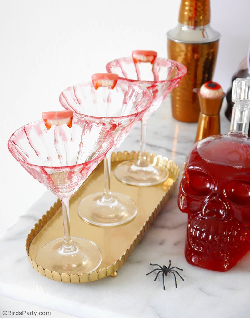 DIY Bloody Halloween Cocktail Glasses  - learn to create this edible blood effect to decorate your cocktail glasses and make them all creepy and spooky! by BirdsParty.com @birdsparty
