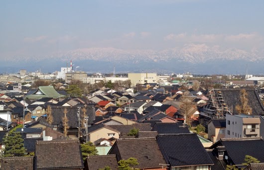 a view of Tateyama Mountain and cityscape from a observation tower in Toyama Bay