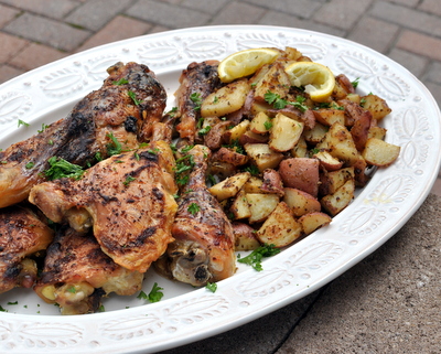 Baked Chicken with Herb-Roasted Potatoes ♥ KitchenParade.com, my mom's recipe, just chicken brushed with sour cream and roasted potatoes alongside.