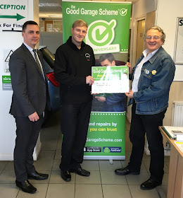 Presentation photo with Good Garage Scheme regional manager and winner at Saunders Abbott 