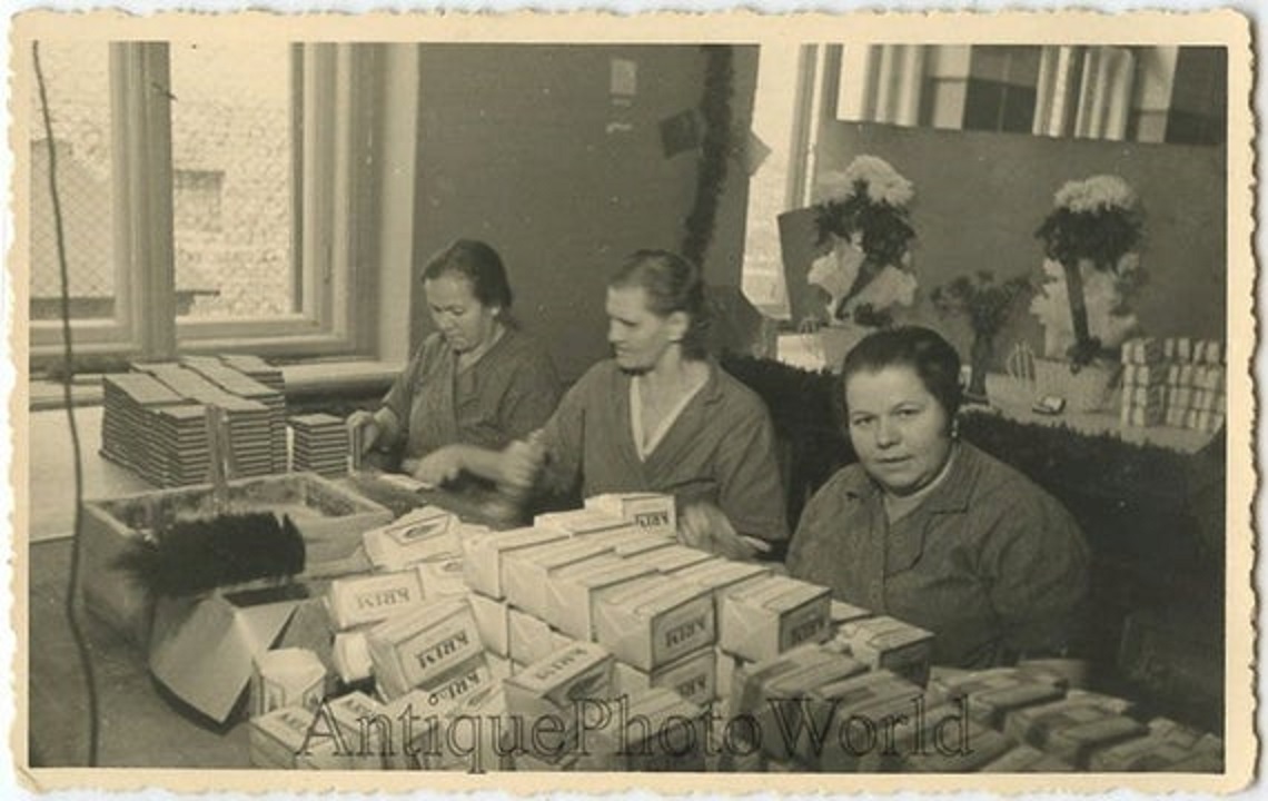 Tabacco Factory Workers with cigarette packs