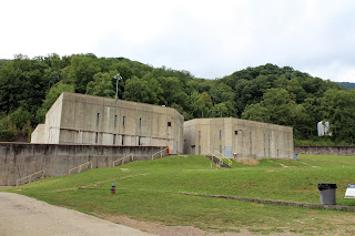 2 concrete buildings with window slats