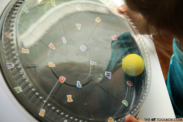 This ball and letter activity helps kids develop hand-eye coordination needed for tasks like handwriting, reading and other occupational therapy activities. This ball and letter activity helps kids develop hand-eye coordination needed for tasks like handwriting, reading and other occupational therapy activities.