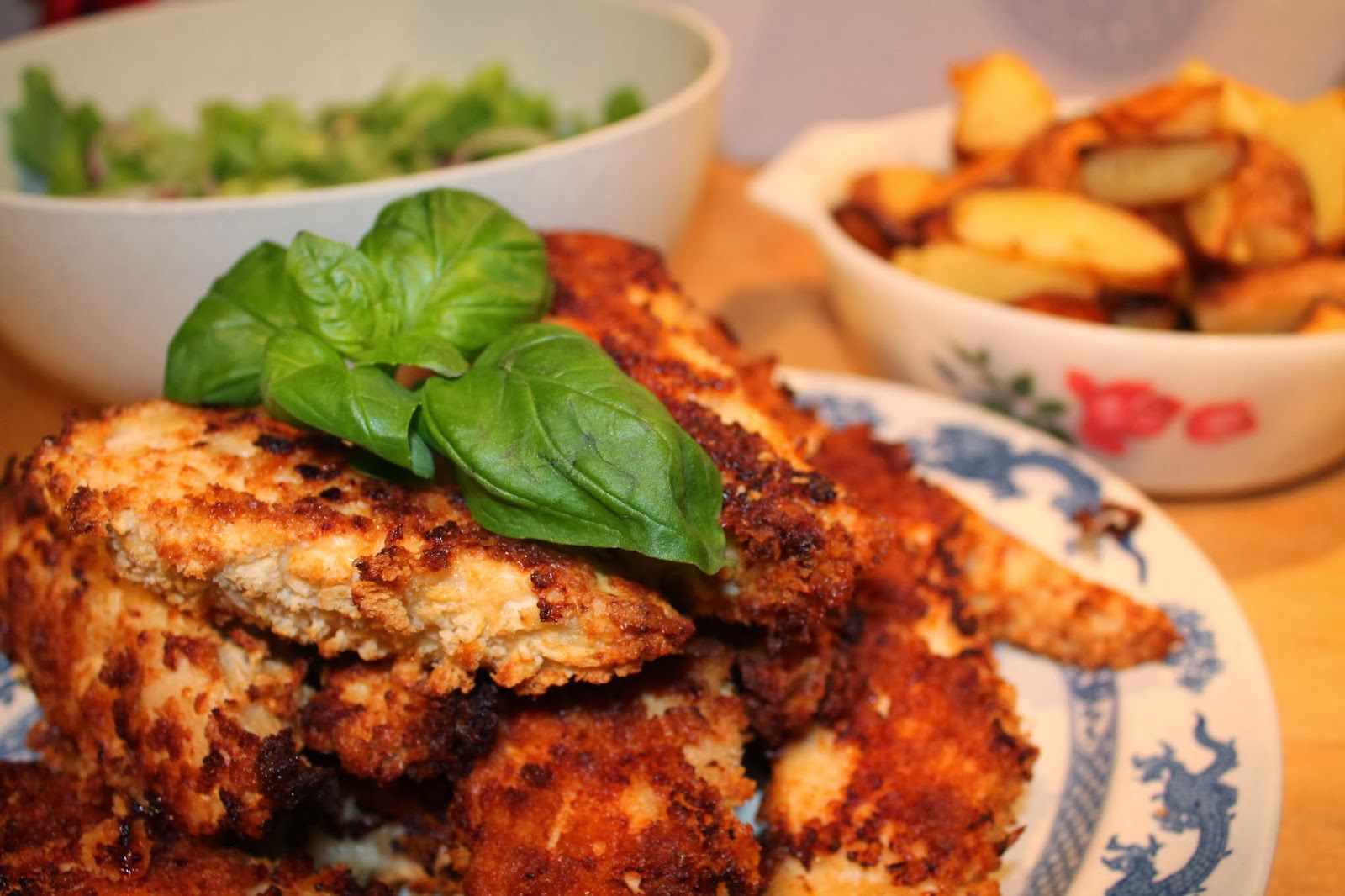 cook, serve, eat breaded chicken with potato wedges