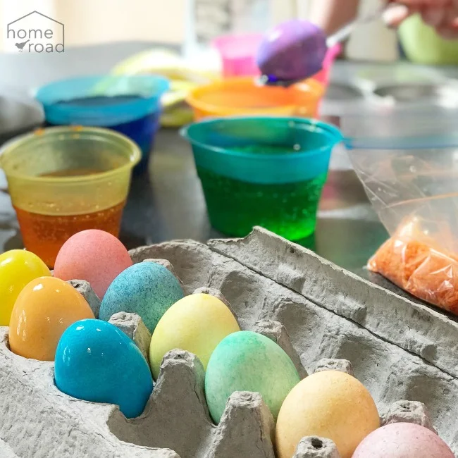 Colored eggs and cups of dye