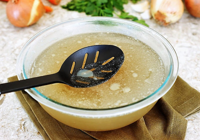 Skimming Fat from Homemade Chicken Broth Image