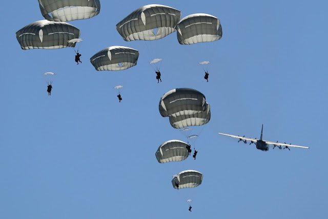 Paratroopers Jumping Out of Lockheed C-130