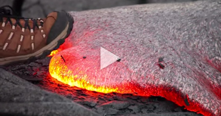 A man steps on glowing hot lava to demonstrate something