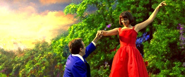 Film still from What dreams may come (1998) / Polygram Filmed Entertainment robin williams Annabella Sciorra más allá de los sueños escena cuadro felices vestido rojo Au-delà de nos rêves red dress Al di là dei sogni