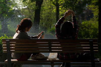 girls on a bench talking