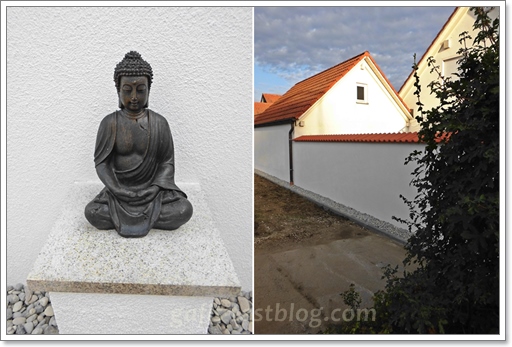 Buddahfigur und Gartenmauer