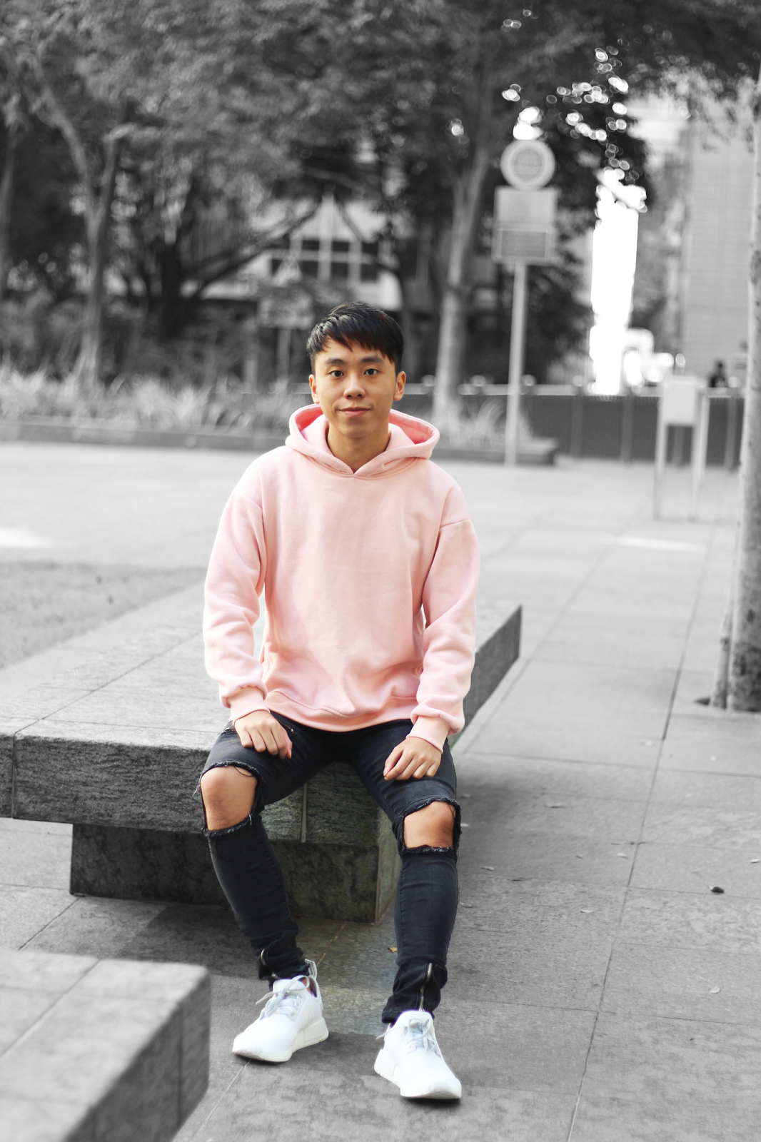 Man In Pink Hoodie And Blue Denim Jeans Sitting On Brown Wooden Bench ...