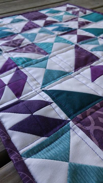 mini purple and teal chaos quilt turned into a puzzle
