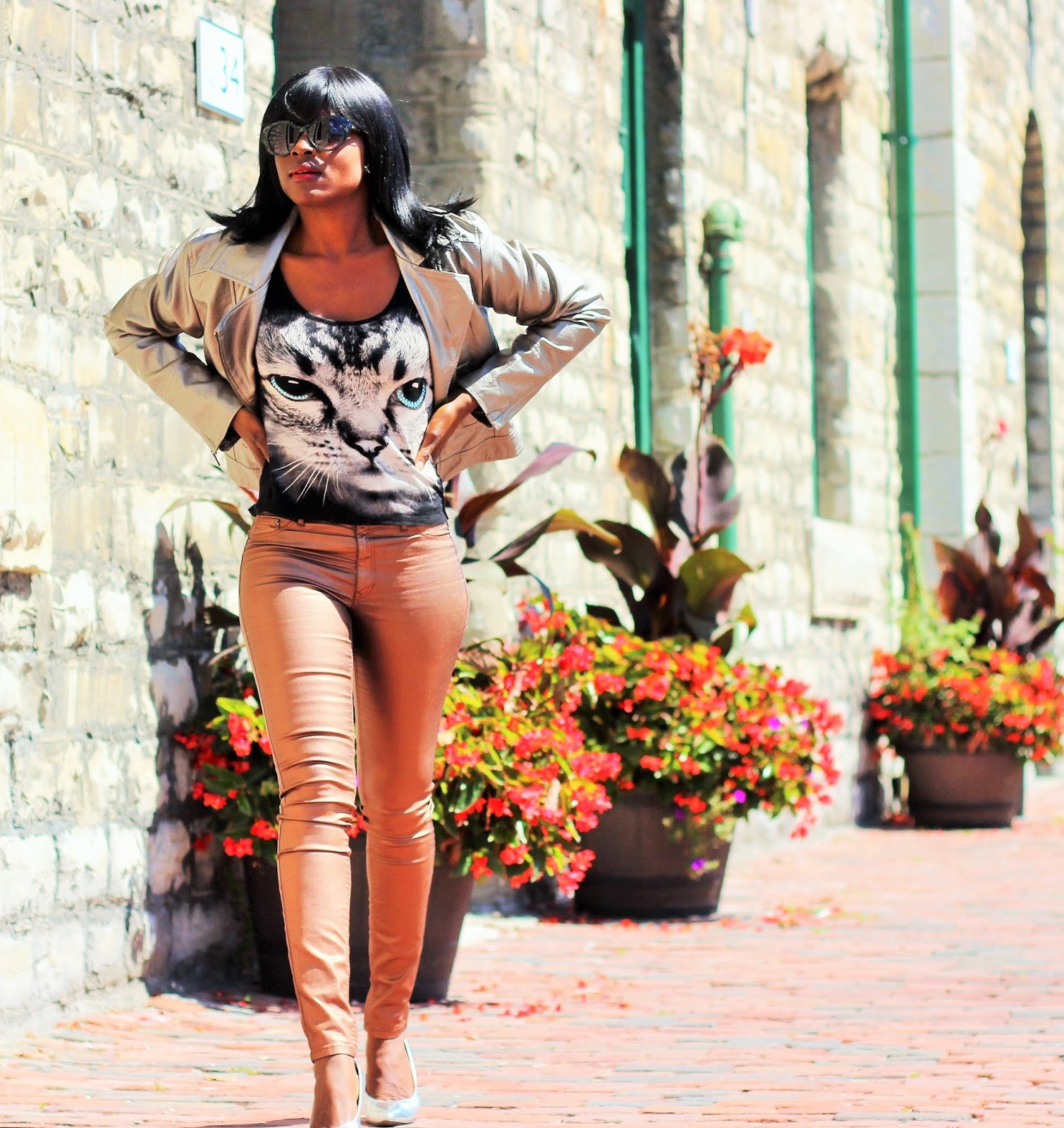 Metallic Gold Jacket Styled With Metallic Gold Pants & A Graphic Top