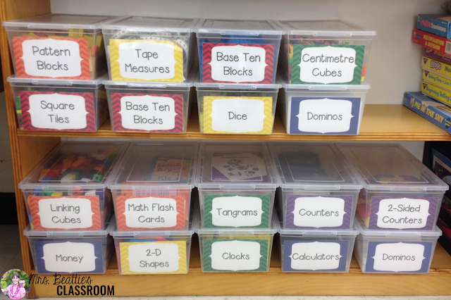 Photo of math manipulatives stored in plastic shoe boxes with labels.