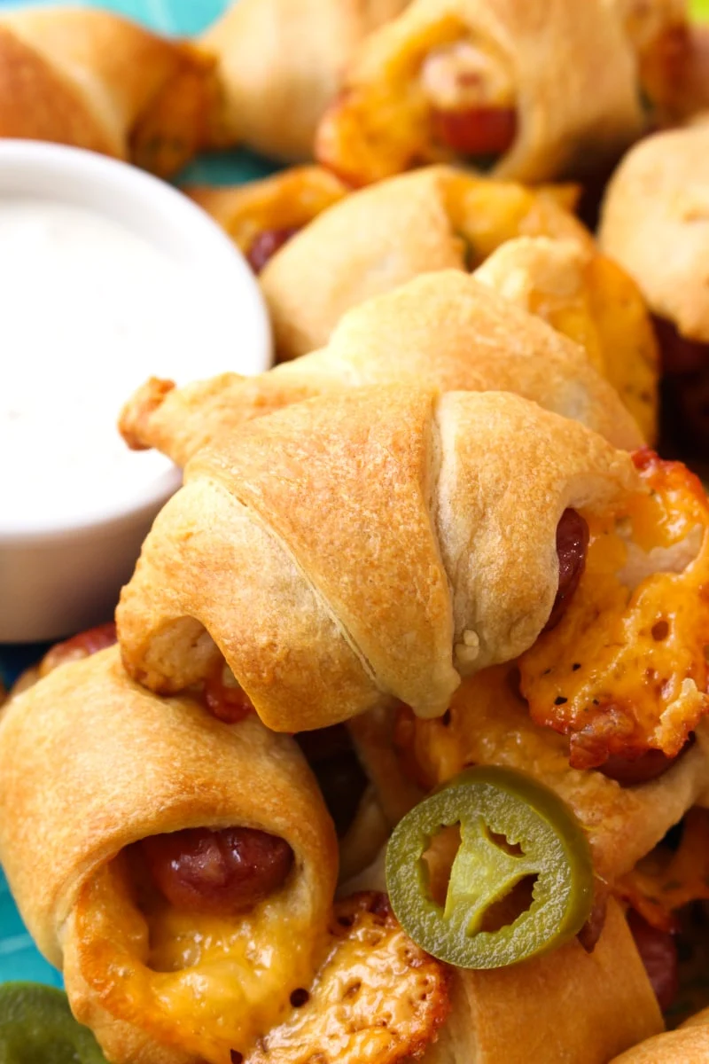 Jalapeño Cheddar Pigs in a Blanket are a twist on the classic party appetizer you know and love! #appetizer #littlesmokies #partyfood #gameday