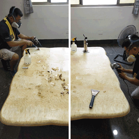 第一環衛石材美容專家戴上防毒面具,小心翼翼的以噴槍加熱,烤軟並刮除桌子表面已經硬化且破裂的塑膠膜。