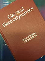 Classical Electrodynamics, 2nd Ed, by John David Jackson, superimposed on Intermediate Physics for Medicine and Biology.