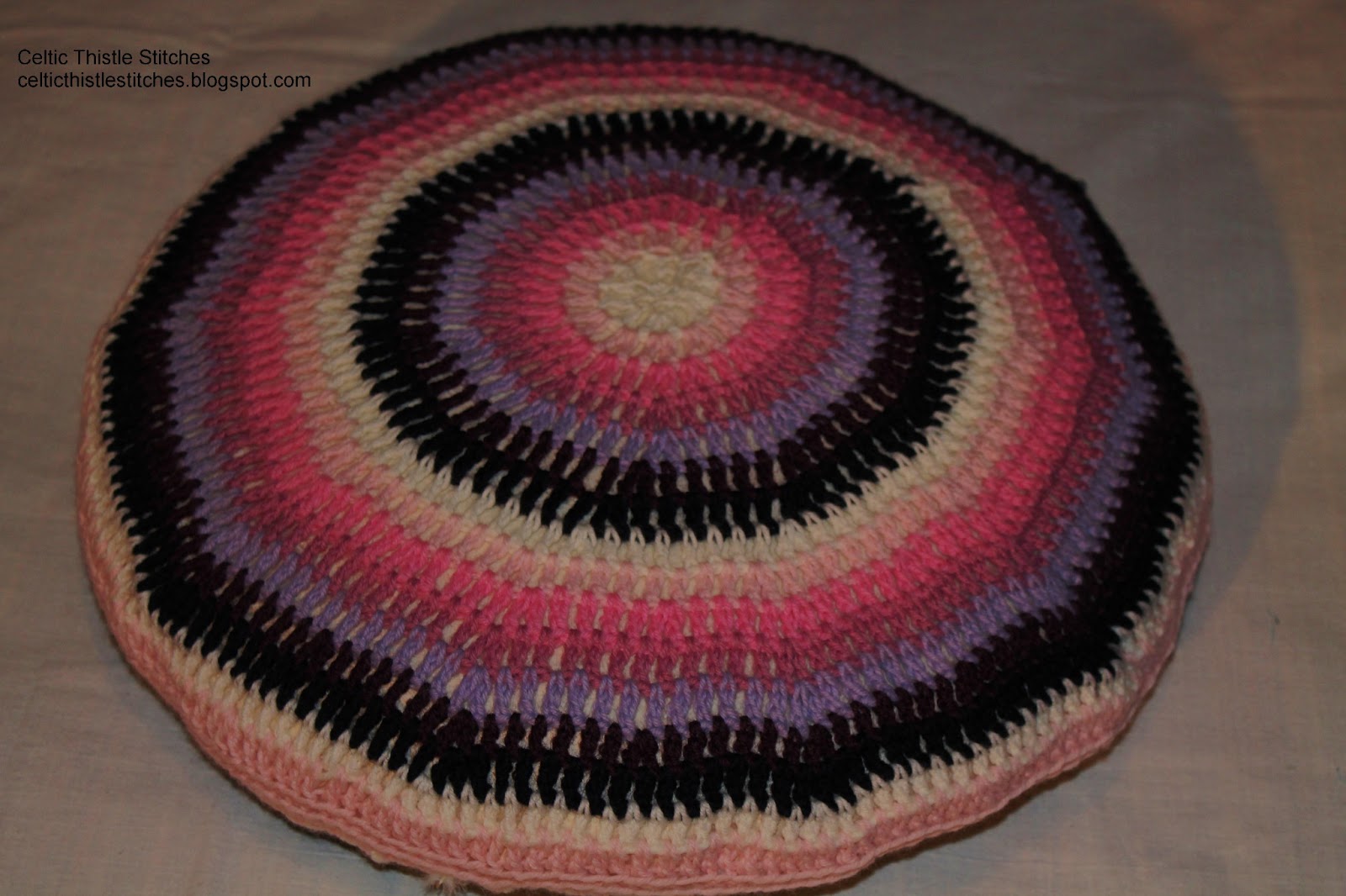 Circular striped crochet cushion