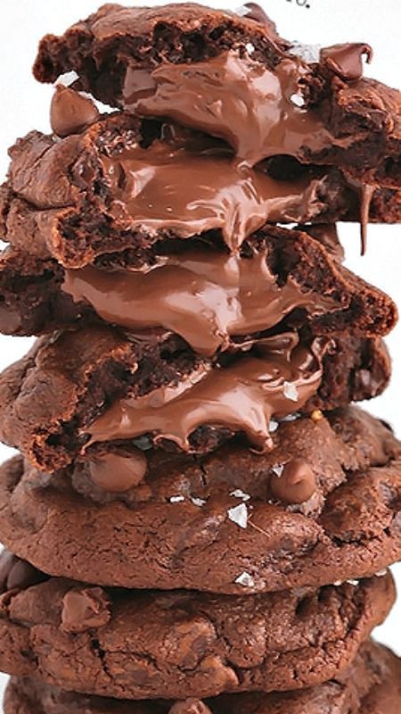 Nutella Therapy Cookies ~ These feel-good-chocolate-cookies are soft and chewy, studded with chocolate chips, stuffed to the brim with Nutella and sprinkled with sea salt. They have proven to be instant spirit lifters. #dessert