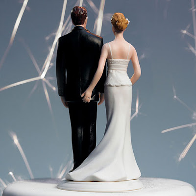 http://www.caketoppersoutlet.com/the-love-pinch-bridal-couple-figurine/