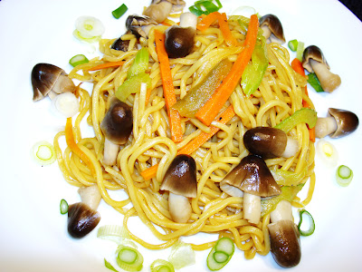 LO MEIN NOODLES WITH STRAW MUSHROOMS PORTIONS: 5 INGREDIENTS 1 lb uncooked lo mein noodles 2 tbsp vegetable oil 1 tsp sesame oil 2 garlic cloves minced 1 tsp ginger root minced ½ cup onions, diced or strips ½ cup of Julienne peppers ( thin strips ) ½ cup Julienne celery 1 cup of Julienne carrots 8 oz straw mushrooms whole 1/4 tsp sugar 2 tbsp soy sauce PREPARATION Keep on the stove a large pot with boiling water. At the mid time, heat up a large saute pan with the vegetable oil and sesame oil. Saute the garlic, ginger, and onions together. Add to the pan peppers, celery, carrots. Cook them al dente. Cook the noodle in the boiling water for 3 to 4 minutes and strain the noodles. Add the noodles, sugar, soy sauce and straw mushrooms to the pan. Mix well and serve