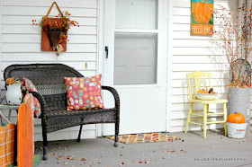 use thrift store finds and pallet wood projects to decorate your porch for fall