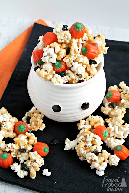 Candy pumpkins and ghost shaped sprinkles are tossed with peanut butter coated popcorn in this irresistible Haunted Pumpkin Patch Popcorn Crunch.