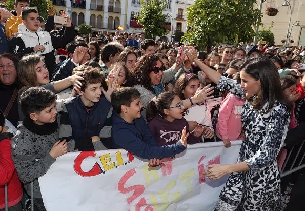 Queen Letizia wore a leopard-print silk blouse and midi skirt by Victoria Beckham. Carolina Herrera slingback black pumps