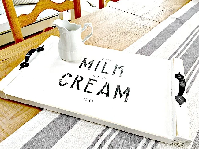 Stenciled milk and cream rustic tray using scraps and black handles.