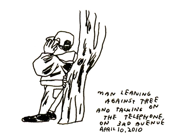 against tree leaning side view a man drawing