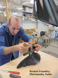 Simone creates a wax sprue for later bronze casting