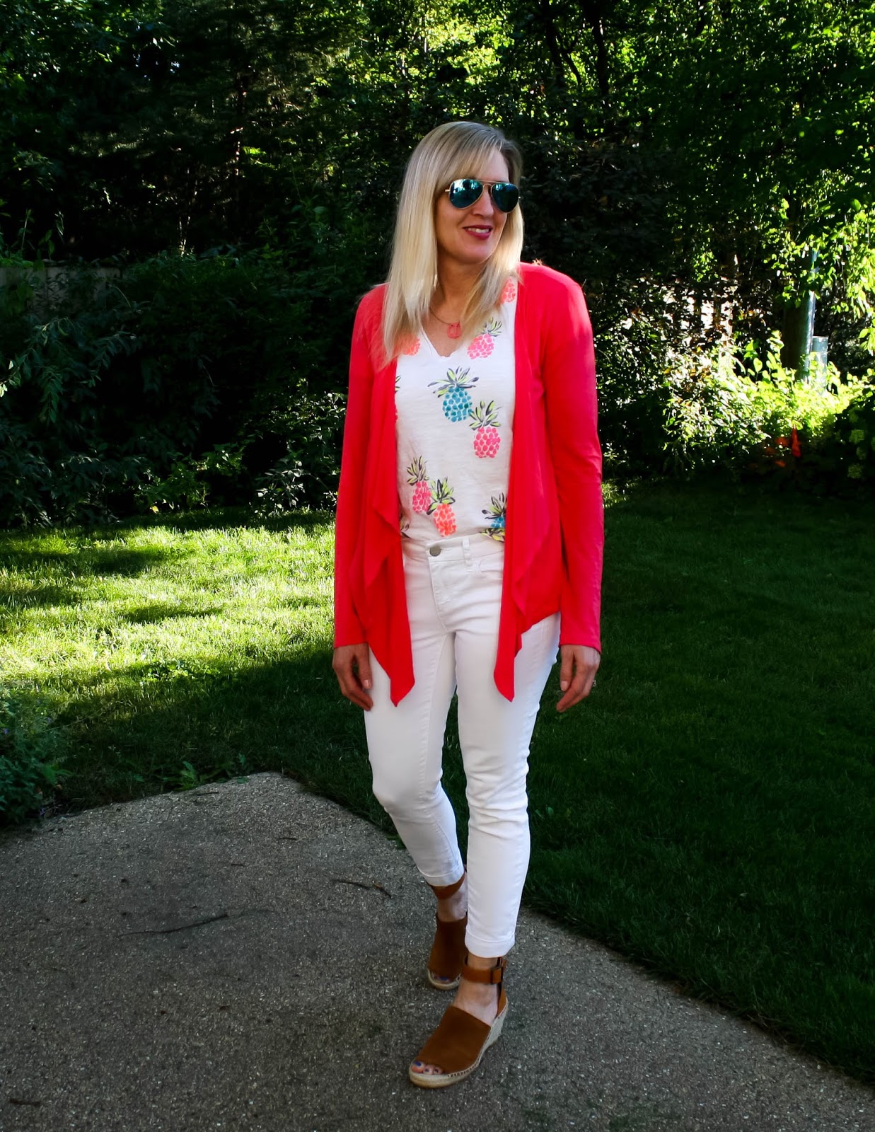 A white jeans outfit with bright red sweater