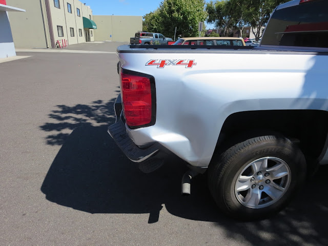Big dents on Chevy Silverado before repairs at Almost Everything Auto Body