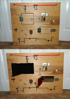 Large wooden activity board with old latches, screws, bolts, and hinges