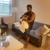 Singer Timaya Celebrates His Birthday As He Cuddles His Son In Adorable Photo