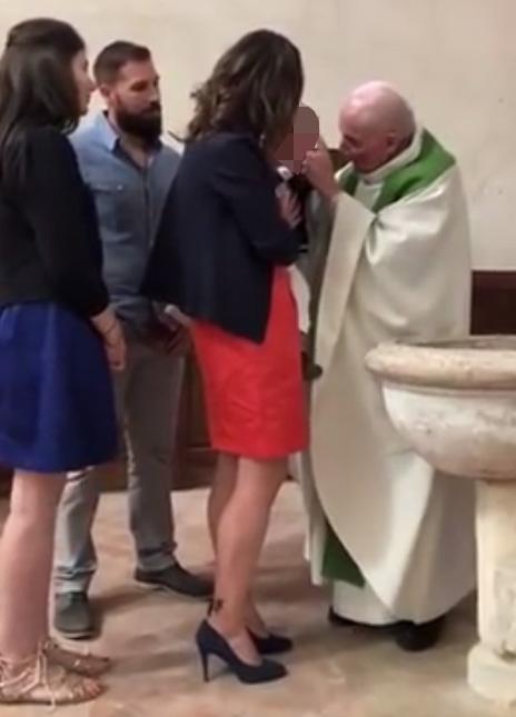 Priest slammed for slapping a crying baby