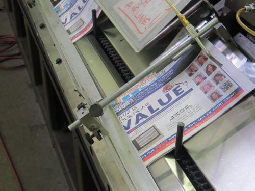 newspaper on a stuffing machine