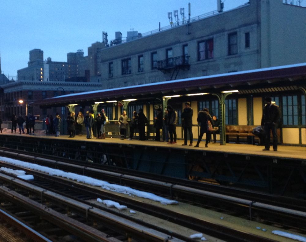 at-the-125th-street-train-platform-the-look-of-a-timeless-wait