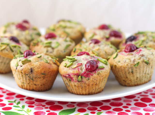 Food Lust People Love: Cranberry pistachio muffins are great on their own for breakfast or teatime, or as part of your holiday buffet table. They aren’t just pretty, they are delicious as well! Maybe you’ve got some whole berry cranberry sauce of the jellied kind left over from Christmas. If so, these cranberry pistachio muffins make perfect use of that abundance. If not, buy a can on sale and bake these babies for your New Year’s Day breakfast. I used the one from Ocean Spray (link in the post.)