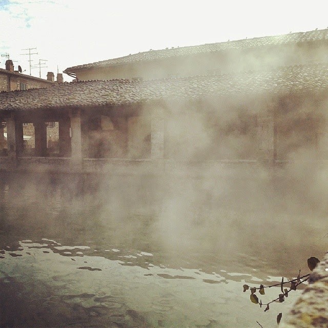 The vapor of the hot springs from the pool in the town square