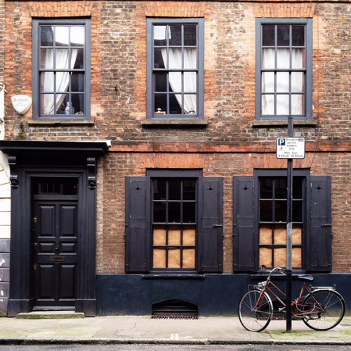 Old Red Brick with Black Trim Content in a Cottage