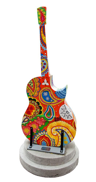downtown Orillia, painted guitar display, bright colourful paisley design