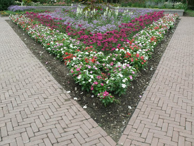 James Garden  triangular annual bed with catharathus by garden muses: a Toronto gardening  blog 