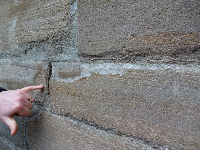 Decayed mortar joints, shown as disaggregation of the stone along the joints Decayed mortar joints, shown as disaggregation of the stone along the joints