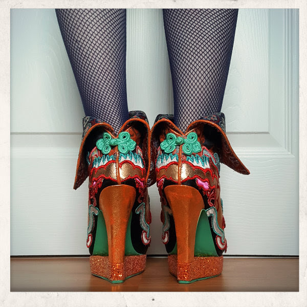 back view wearing irregular choice tatsu with glitter platform and cut out heel back view wearing irregular choice tatsu with glitter platform and cut out heel