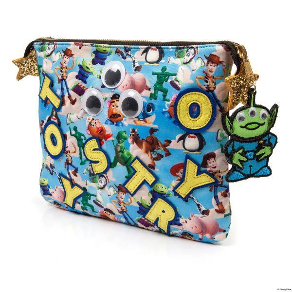 Irregular Choice Disney Toy Story Eternally Grateful back of pouch back of clutch bag shown at angle in Disney Toy Story printed material with yellow applique letters and alien zip pull