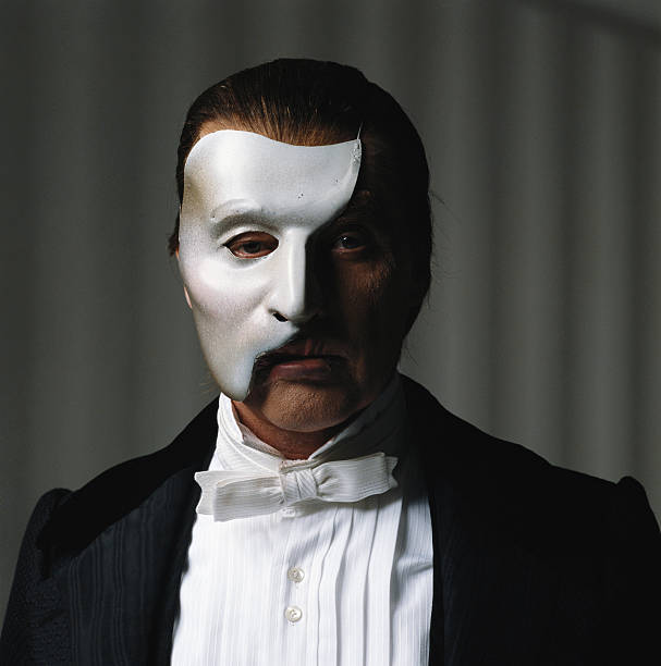 Collection 105+ Images why does phantom of the opera wear a mask Completed
