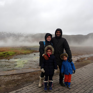 ABostonFamily bundled up for the cold near the Strokkur Geyser in Iceland in February